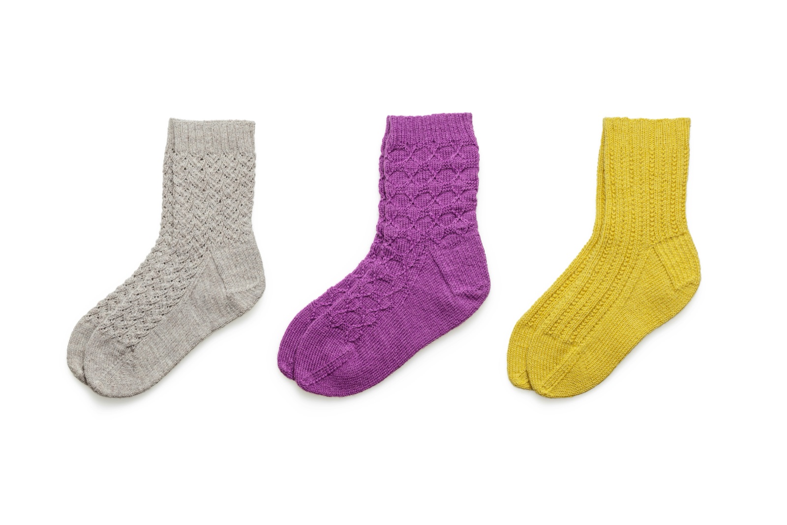 Colorful socks arranged together to represent sock styles through the decades